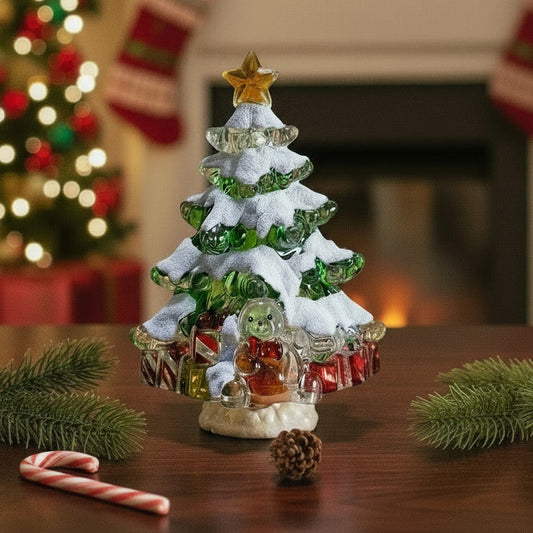 Decorative Christmas tree with colorful ornaments on a wooden table, festive background.